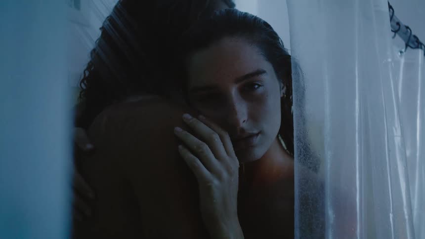 Boyfriend and girlfriend are hugging in the shower together