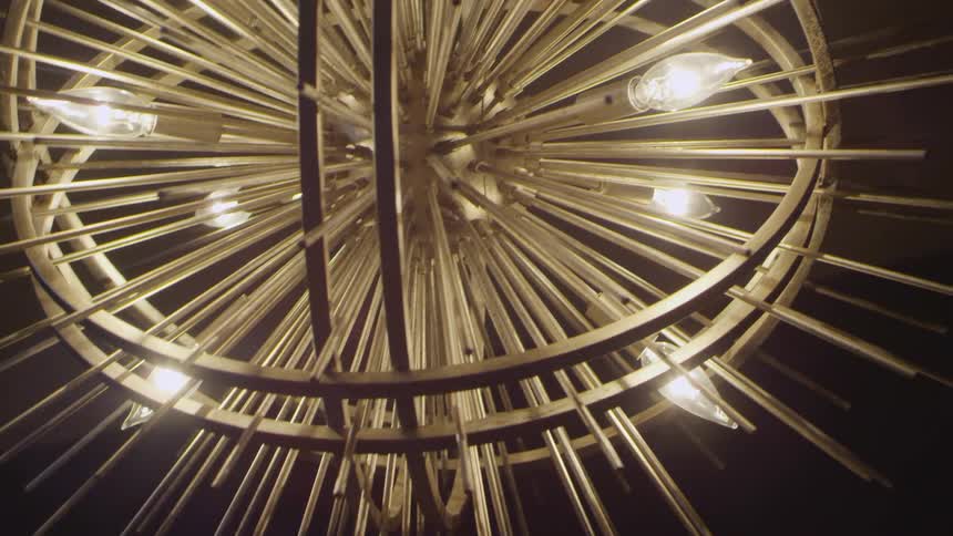 A spiky light fixture in a dark room