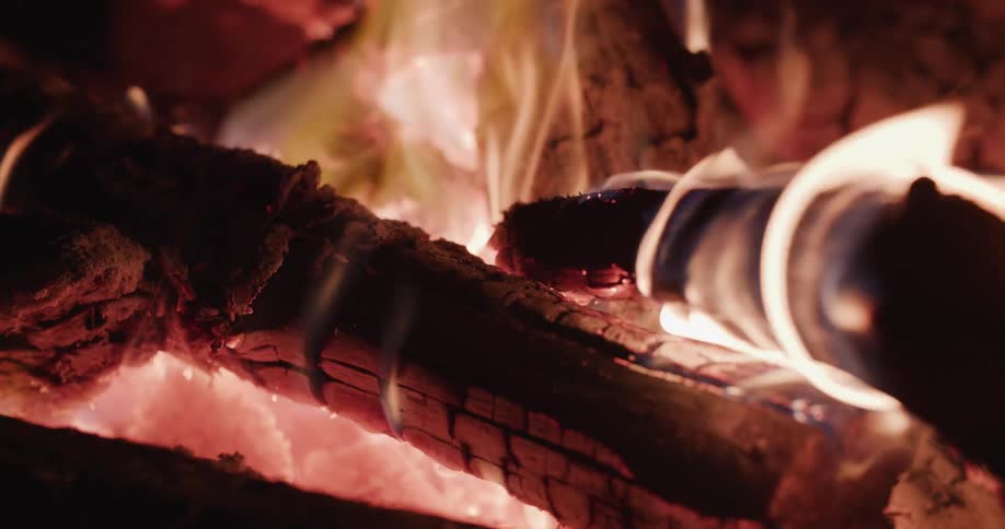 Close up view of a bonfire at night is displayed