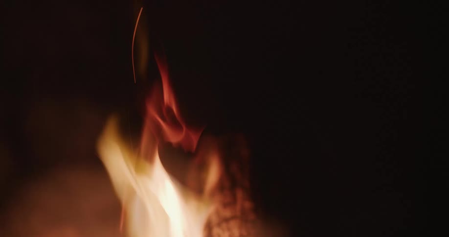 Flames leap up from a large bonfire