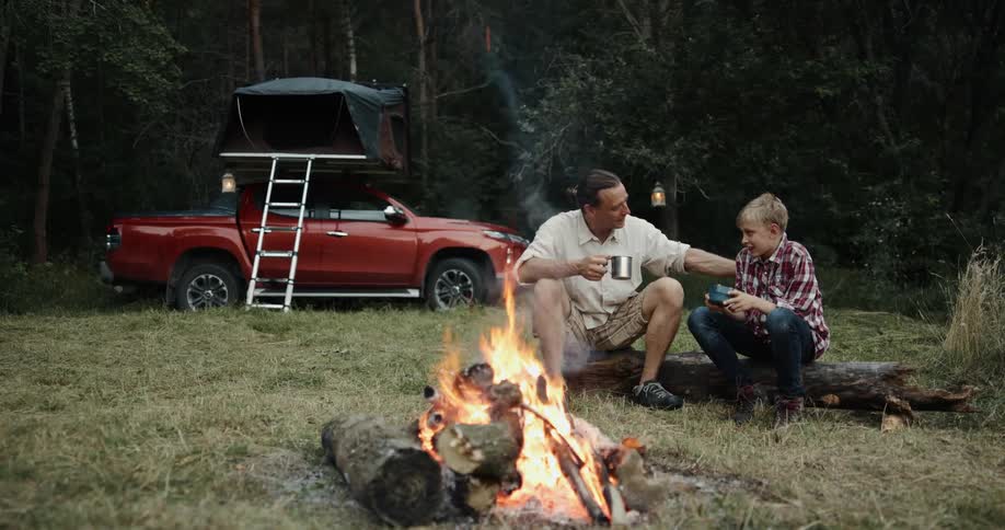 A view of two people sitting outdoors