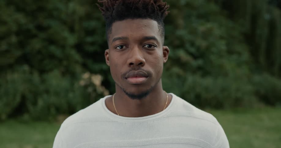 A man looks up on the field