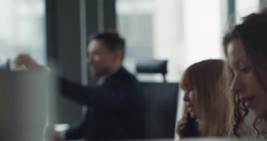 People are working at their desks in the office