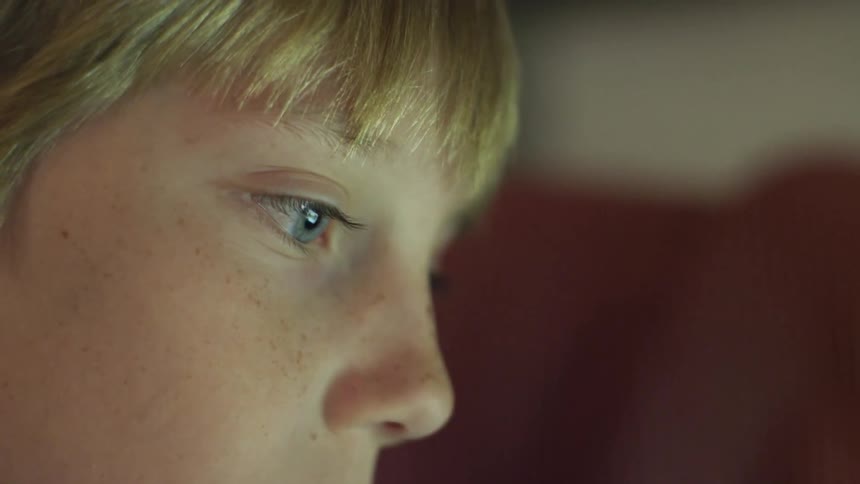 A boy's eyes as he focuses on something