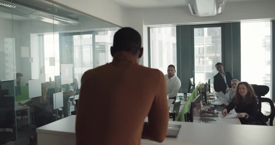 Coworkers talk in the office