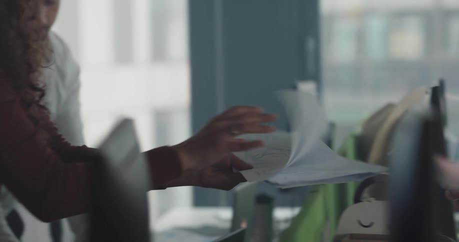 Office workers cooperate to complete paperwork