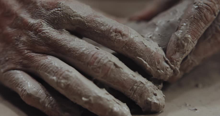 A person sculpting with clay