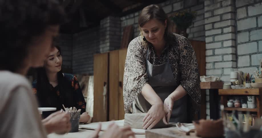 People are learning how to sculpt with clay