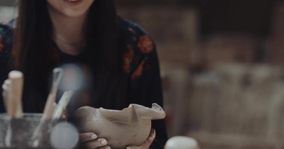 Man and woman are making crafts together and smiling