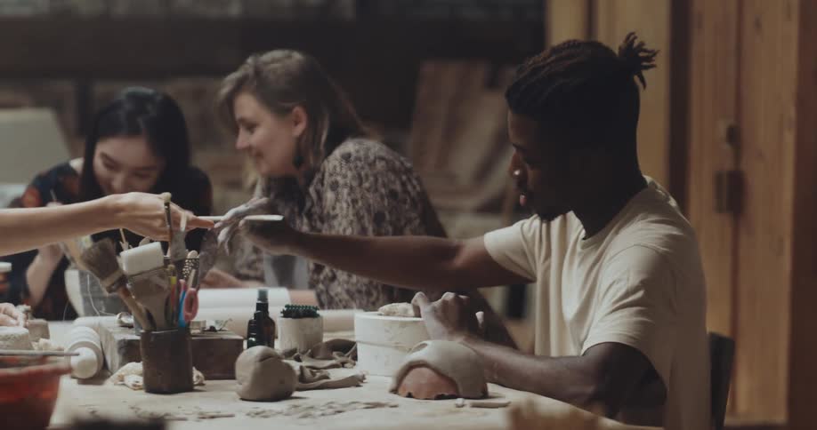 People work on sculpting in the room