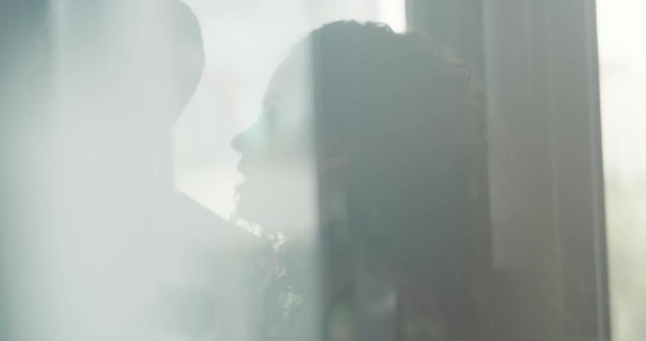 Two coworkers are talking together in their office