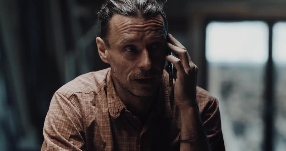 A man is talking on his cell phone