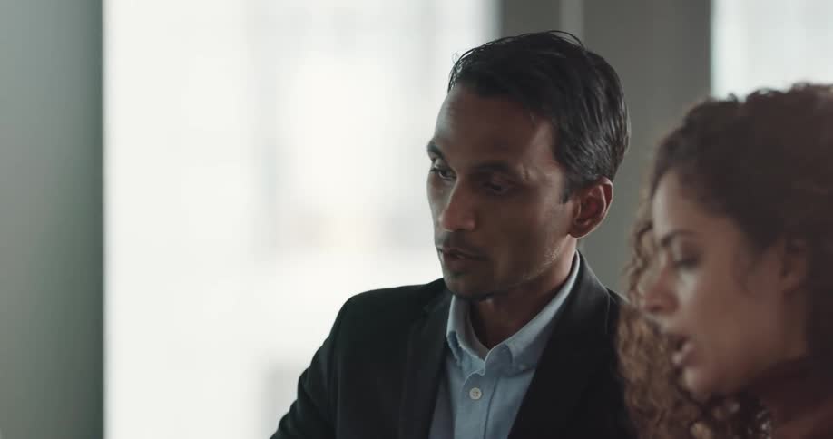 Group of business people talking while writing on a whiteboard on the office