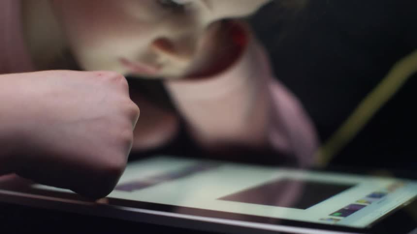 A girl is using a tablet