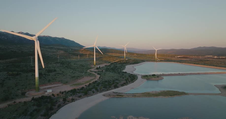 Aerial view of windmills in a rural area is displayed