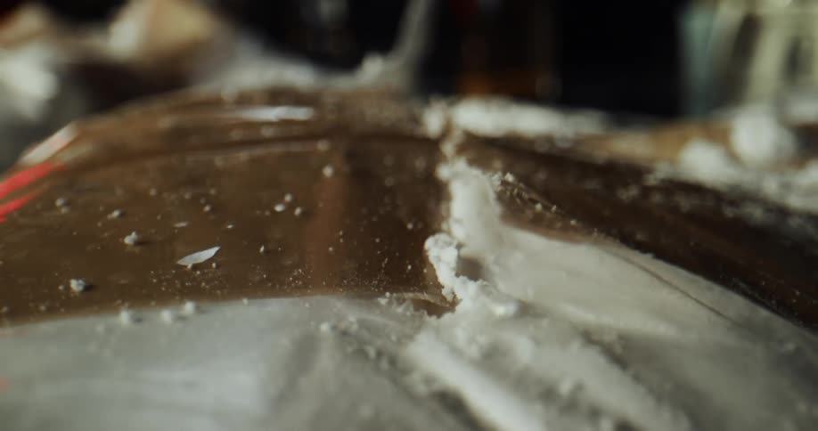 A bag of cocaine is cut open