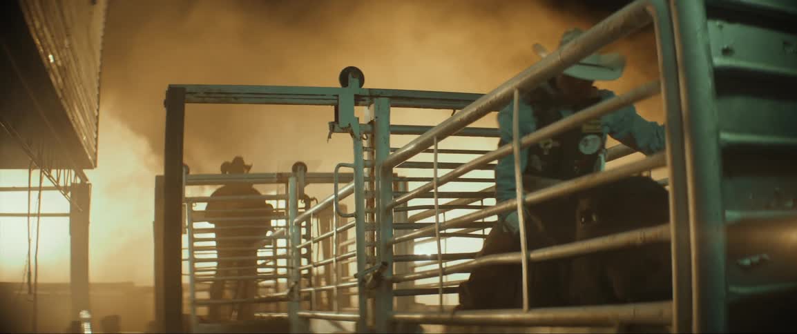A cowboy gets ready to ride a bull