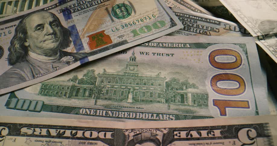 Close up of united states dollar bills of various denominations