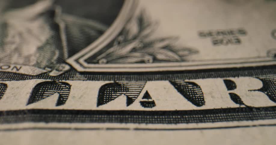 One dollar bill has series number and secretary of the treasury signature
