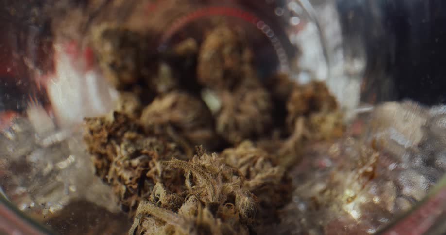 Close up of marijuana buds piled in a mason jar