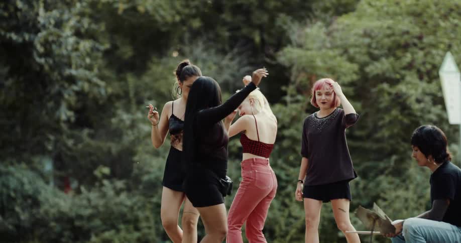 A group of friends are hanging outdoors together during spring
