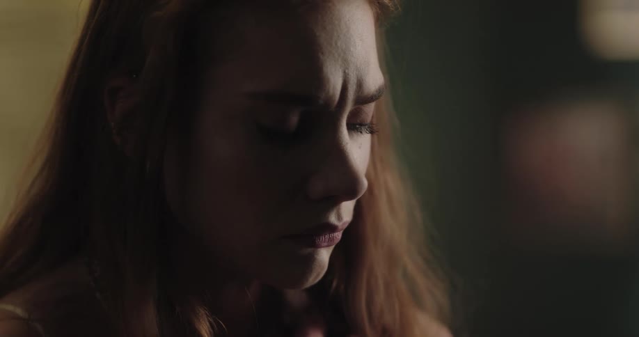 Thoughtful lonely young redhead woman with a sad face