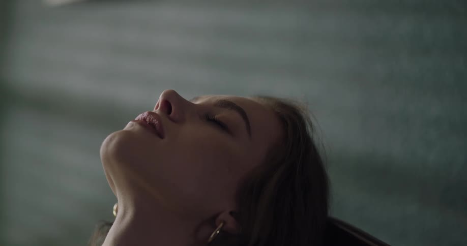 A woman is resting and closing her eyes