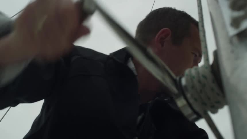 A man is pulling a lever on a ship