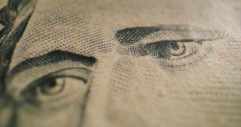 The security marking and colors next to hamiltons face on a ten dollar bill