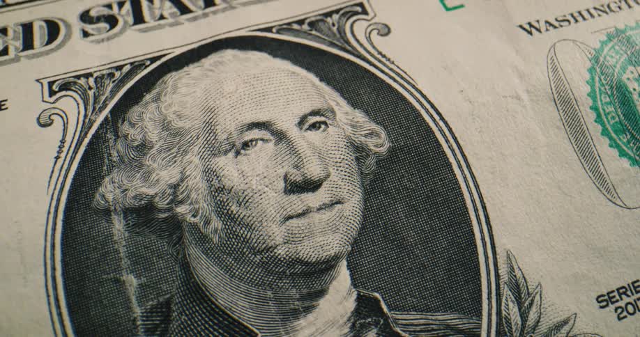 Close up view of a dollar bill is displayed