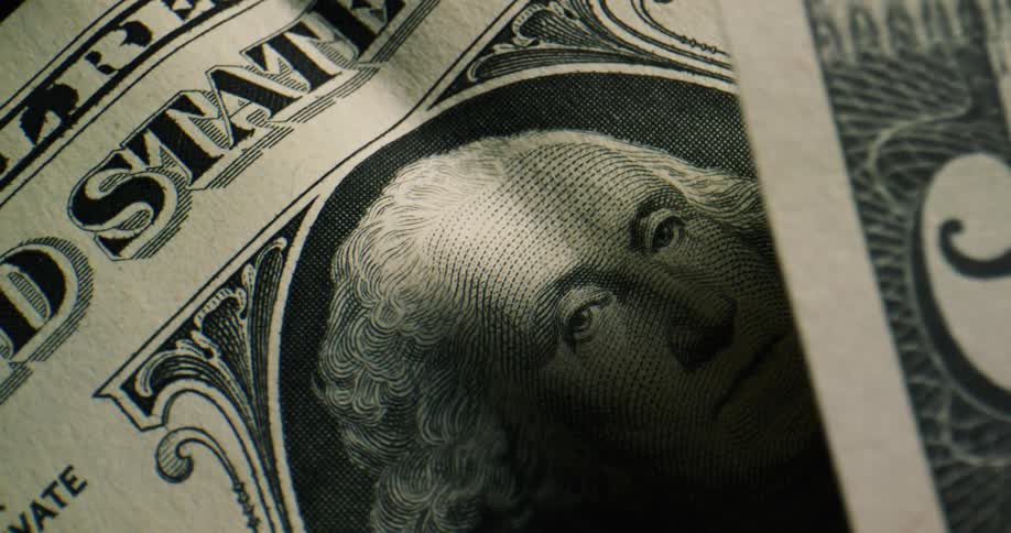 Close up view of a dollar bill is displayed