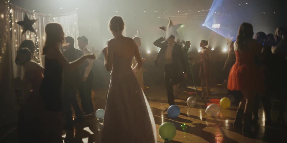 People dance at a school dance