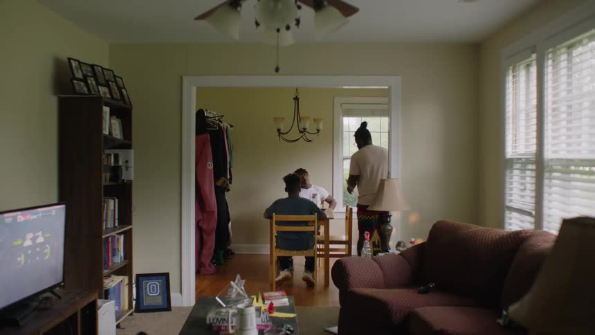 Family sitting together at the dinner table at home
