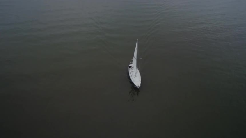 A boat is traveling across the water