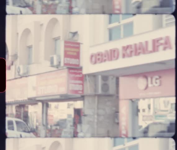 People walk past and enter and leave shops