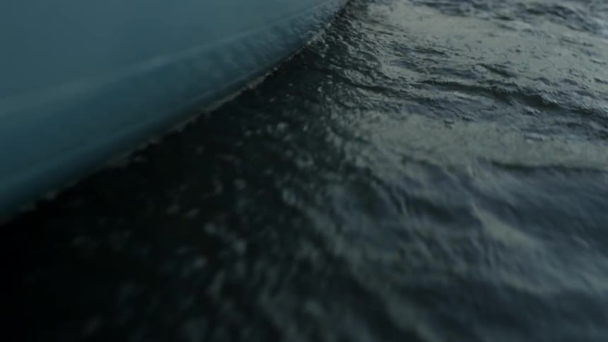 Outside of a boat as it travels in water