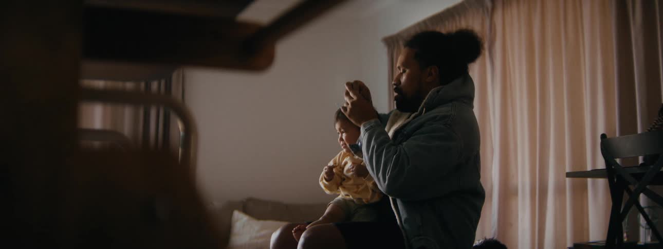 A father and a daughter are hanging out together