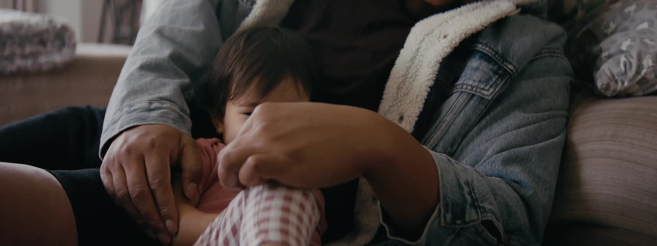 A father is playing with there child in the daytime