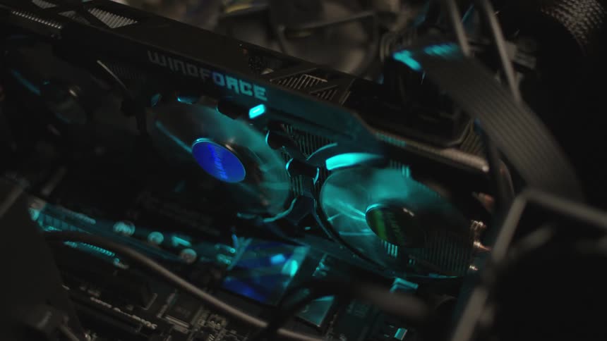 The fans on a graphics card spin inside of a computer