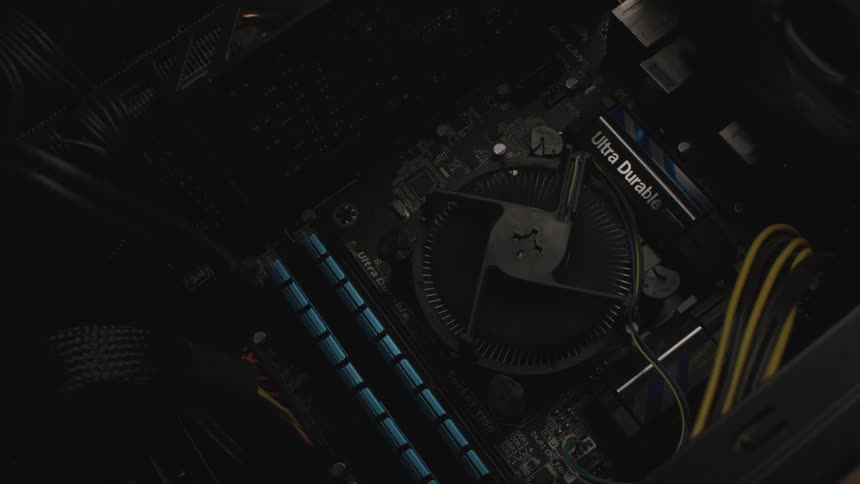 A light sweeps back and forth across a motherboard