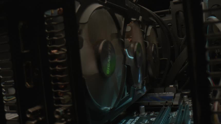 Graphics Card with spinning fans inside a Computer