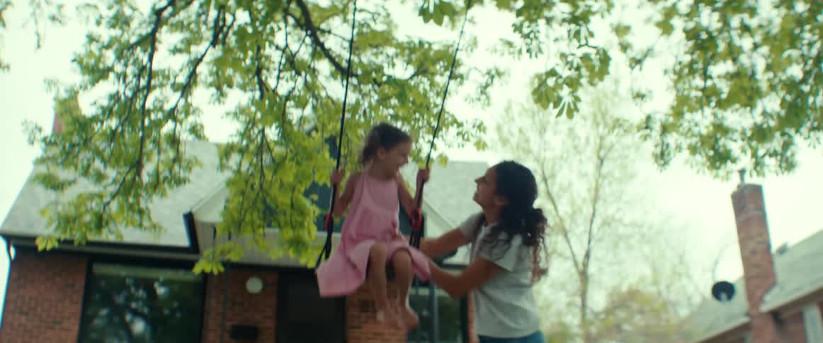 Mother and daughter are playing outdoors during the spring time