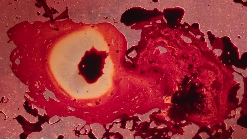 A viscous liquid moves as blotches rise and move around