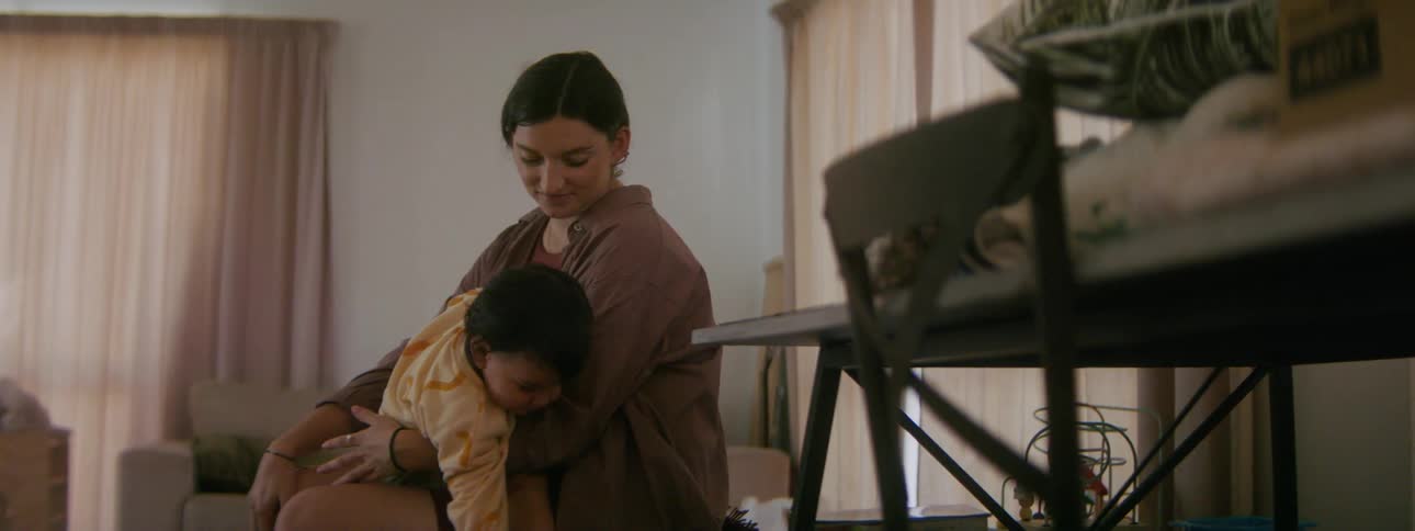 A mother and daughter are playing together in there room