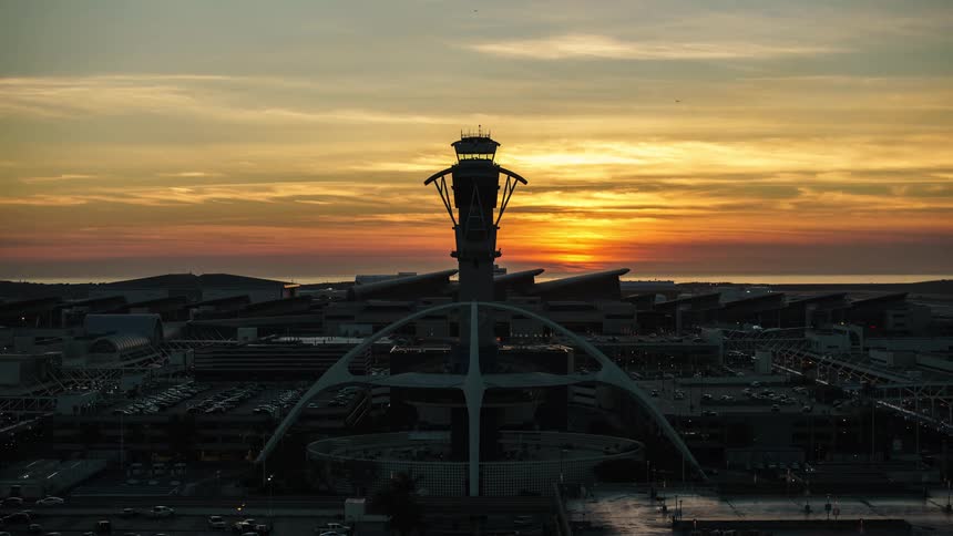 A view of air traffic control tower at LAX airport in a timelapse