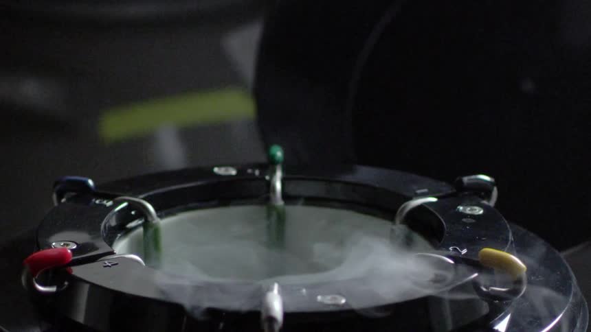 Mist comes out of a black container