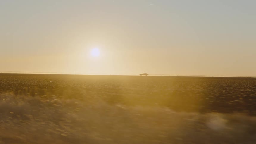 A view of a plains and grasses outdoors