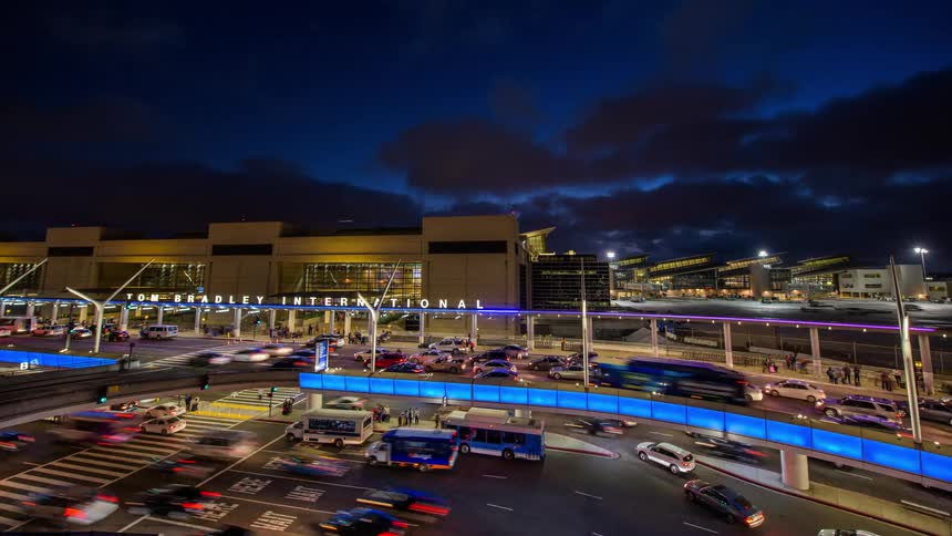 A time lapse of traffic moving through LAX and people moving in and out of the terminal