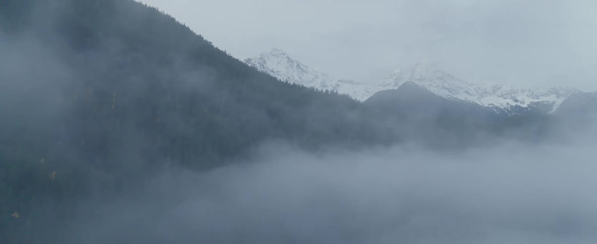 Foggy snow covered mountain range