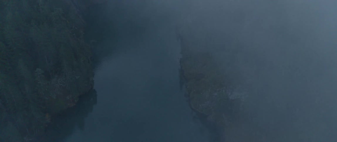 A calm river on a foggy night in nature